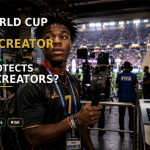 Black creator holding a livestream camera inside a World Cup stadium media area as security, broadcast screens, and sponsor signage surround him.